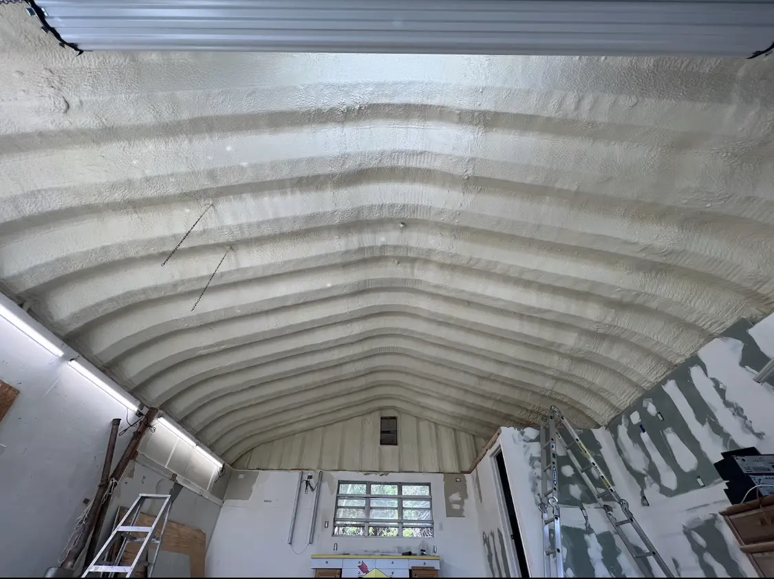 Spray polyurethane foam applied to the underside of a metal roof deck in Floyds Knobs